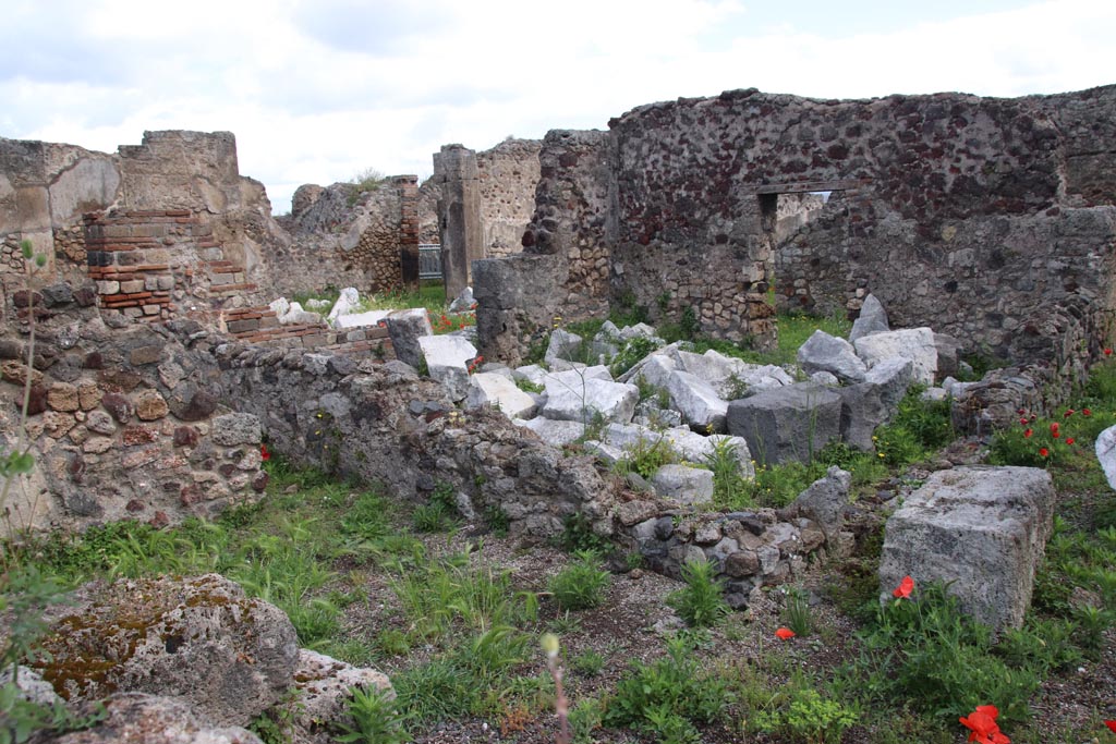 VIII.3.31 Pompeii. May 2024. 
Looking east across small room or cupboard in the north-west corner of the peristyle, towards the oecus with two doorways.
Photo taken across the wall of VIII.3.29. Photo courtesy of Klaus Heese. 
