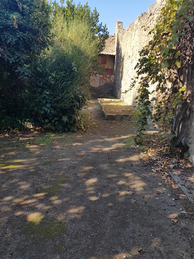 VIII.5.15 Pompeii. October 2022. 
Room 2, looking west along north wall towards area of triclinium. Photo courtesy of Klaus Heese.
