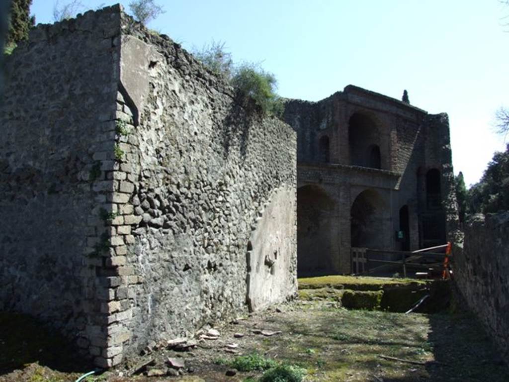 VIII.7.21 Pompeii. March 2009. The rear of the perfumed water tank. Looking south to the entrance to the Large Theatre.