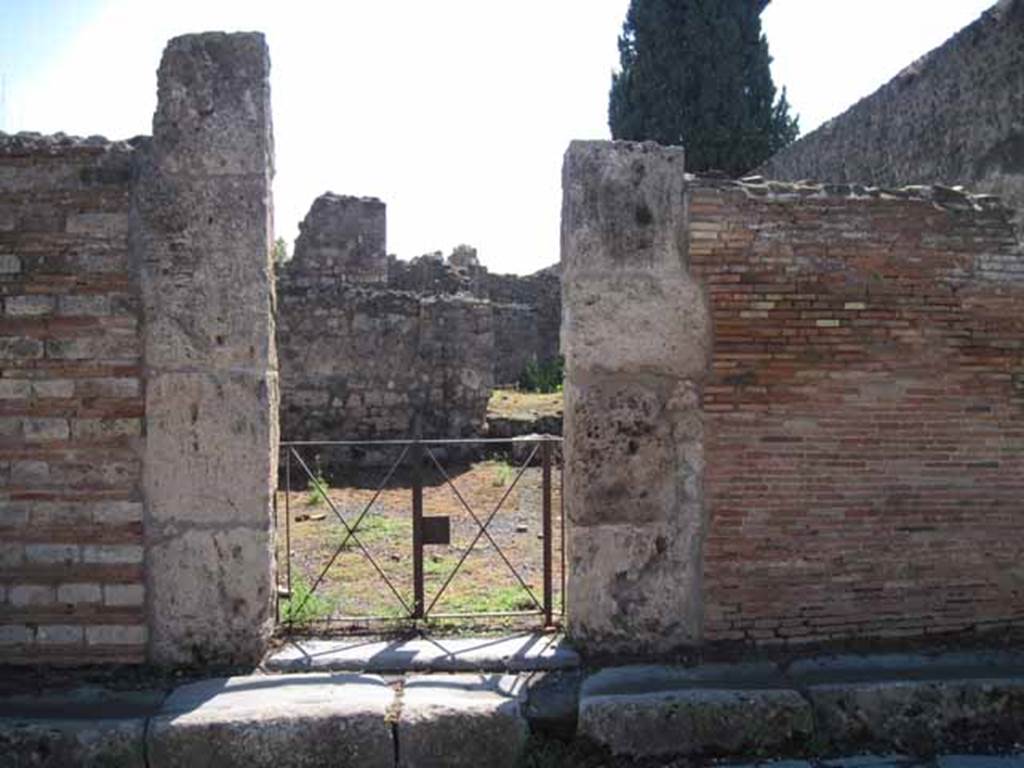 VIII.7.26 Pompeii. September 2010. Entrance doorway, looking south (from across Via del Tempio dIside). Photo courtesy of Drew Baker.
