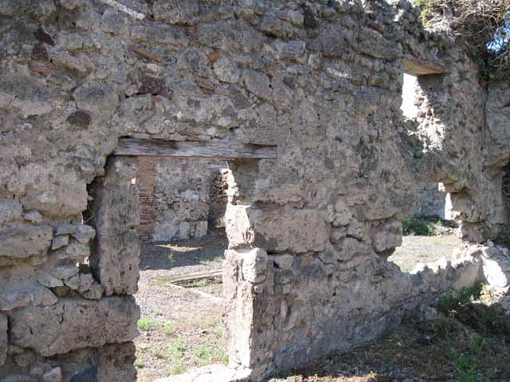 VIII.7.26 Pompeii. September 2010. West wall of triclinium, looking west through doorway and window into atrium. Photo courtesy of Drew Baker.
