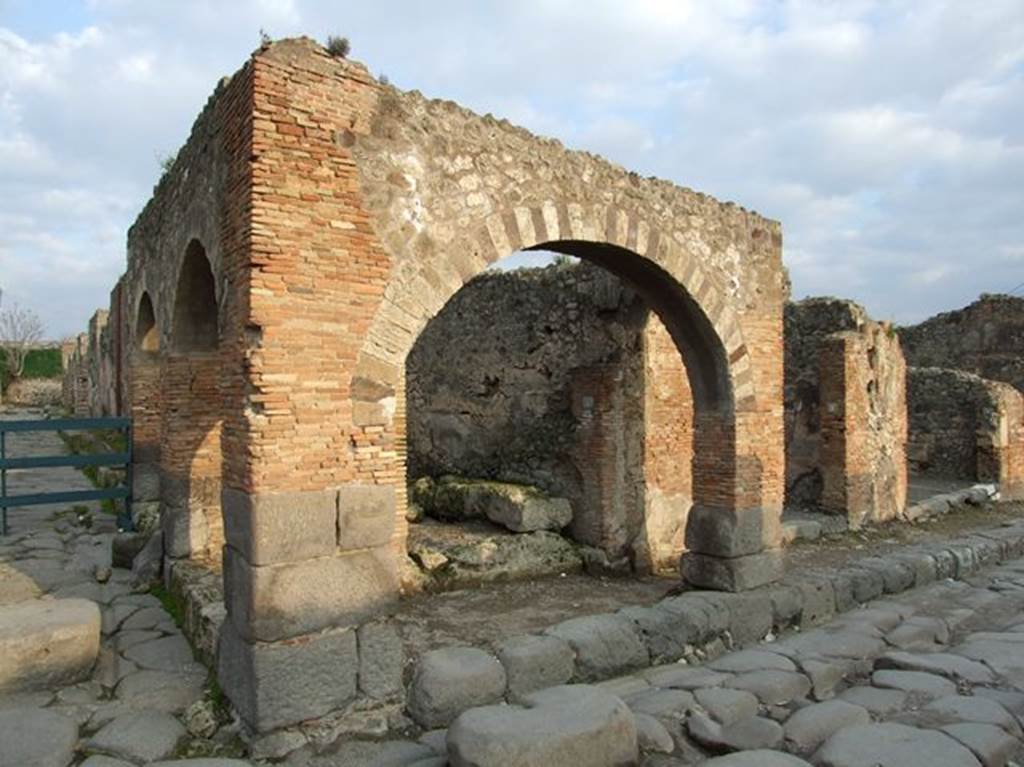 IX.2.1 Pompeii, on left. December 2018. Looking south on Via Stabiana, between IX.2 and VII.1. Photo courtesy of Aude Durand.