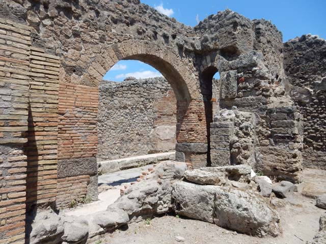 IX.2.1 Pompeii. May 2017. Bench and entrance IX.2.28, looking north-east out to unnamed vicolo. Photo courtesy of Buzz Ferebee.

