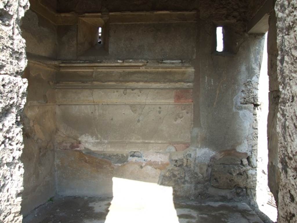 IX.2.17 Pompeii. March 2009. Room 2, cubiculum. East wall with small window onto Vicolo di Tesmo. The walls in this room preserved the traces of Ist Style decoration. 
