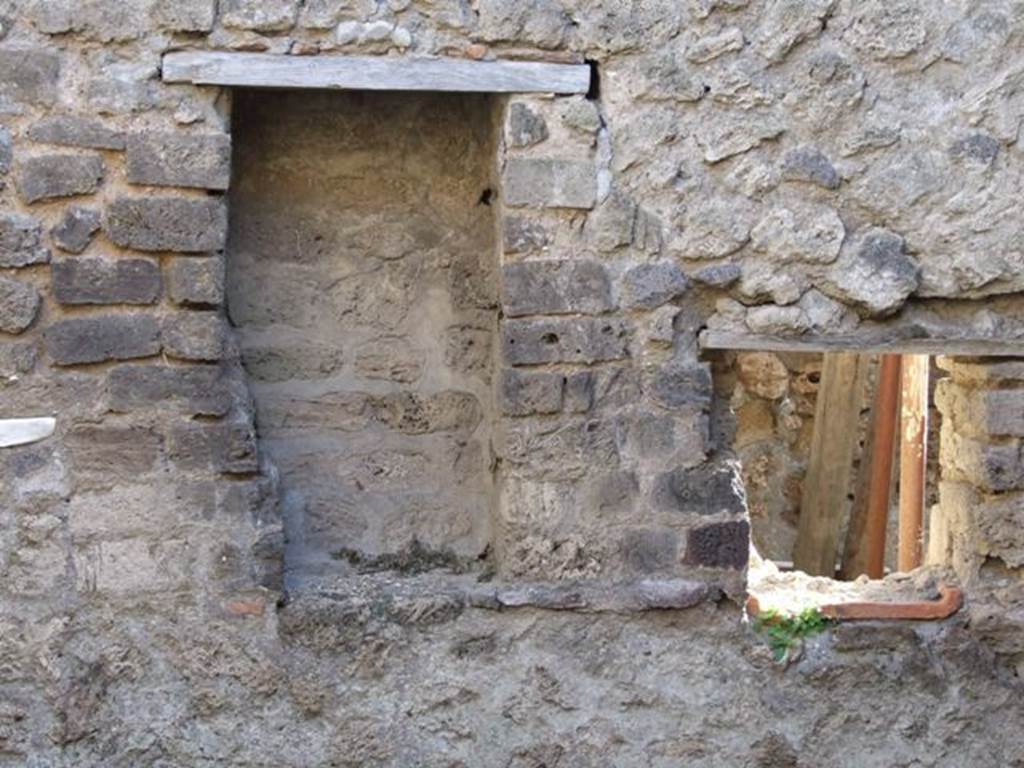 IX.5.4 Pompeii. December 2007. 
Room d, south wall in bakery area, recess and window or hatch for access to the side of the oven, in the next room, room f.
