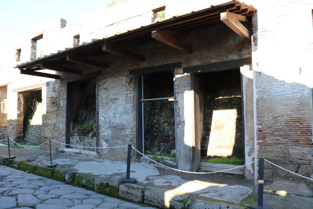 IX.7.8 Pompeii, on left. December 2018. 
Looking west along north side of Via dellAbbondanza, with IX.7.7 to 5, centre and right. Photo courtesy of Aude Durand.

