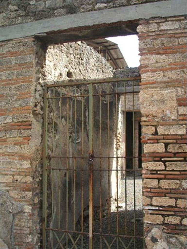 IX.7.20 Pompeii. May 2005. 
According to Della Corte, this elegant dwelling with its singular arched portico on the east side of the peristyle, was the dwelling of D. Caprasio Felici.  
This was demonstrated in the first place by an amphora of wine that came from the producer A. Atinio Crescente.
This was sent to him with the address repeated twice:  D. C. F.      D. Caprasio Felici      [CIL IV 5650 a and b]

Written in the atrium was a salute to him and his consort Fortunata, from an unknown Successus -
Successus Felici salutem et Fortunatae       [CIL IV 5373]
Nothing would have been more natural in the house of a Fortunata, than the cult attributed to Fortuna.
A graffito found near the lararium alluded to the same god - Fortuna    [CIL IV 5371]
See Della Corte, M., 1965.  Case ed Abitanti di Pompei. Napoli: Fausto Fiorentino. (p.212)

According to Epigraphik-Datenbank Clauss/Slaby (See www.manfredclauss.de) these read as –

Summ(arum)
AAAA
LXX
A(uli) Atini Crescentis
/ 
[3]freius A[ti]ni C[re]s[centis]        [CIL IV 5650 a and b]

Fortuna      [CIL IV 5371]

Suc(ces)sus Fel[i]ci salutem
et For(tu)natae       [CIL IV 5373]

