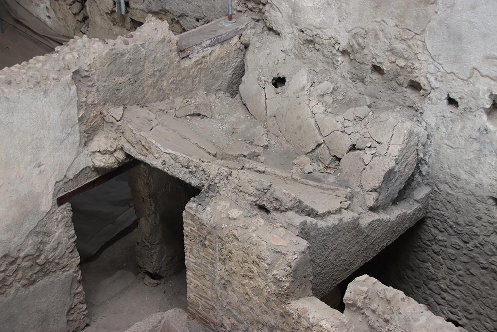 IX.12.6 Pompeii. October 2024. 
Room “n1”, north-east corner and east wall, with doorway leading to room “o” and latrine. Photo courtesy of Klaus Heese.
