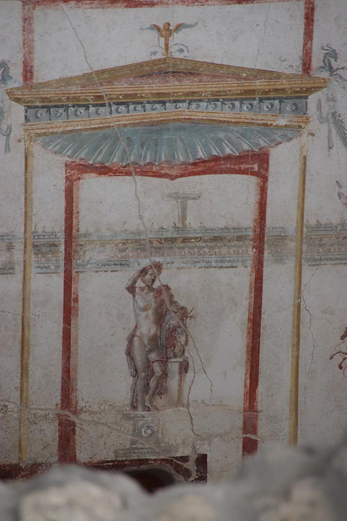 IX.12.A/IX.12.9 Pompeii. October 2024. Room 18, centre of upper east wall, detail of Apollo. Photo courtesy of Klaus Heese.