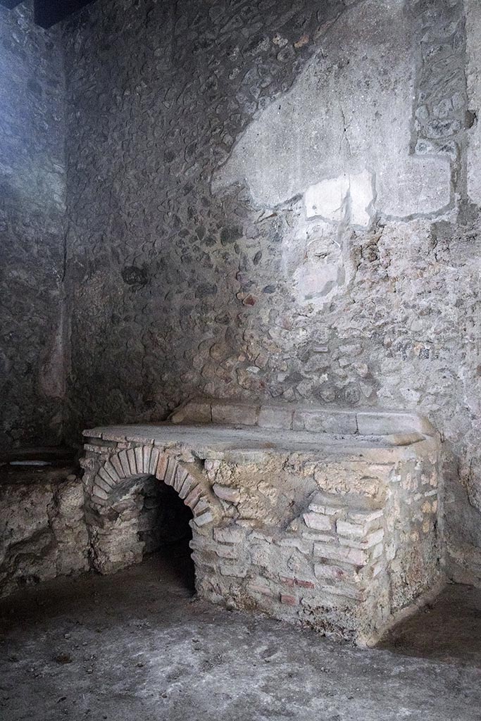 IX.14.4 Pompeii. July 2024. 
Room 18, north wall above hearth. Photo courtesy of Johannes Eber.

