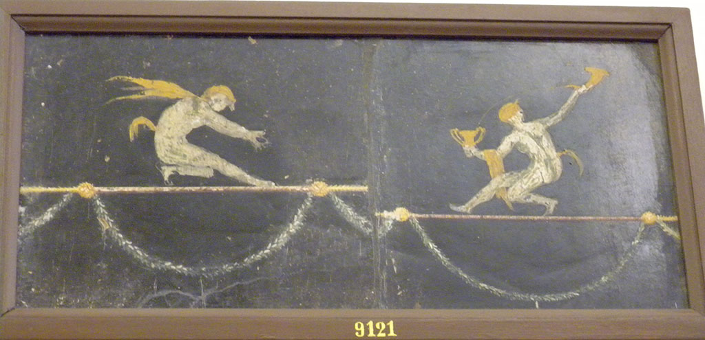 HGW06 Pompeii. Found in triclinium on 18 January 1749. Two acrobatic Satyrs.
Now in Naples Archaeological Museum. Inventory number 9121.
