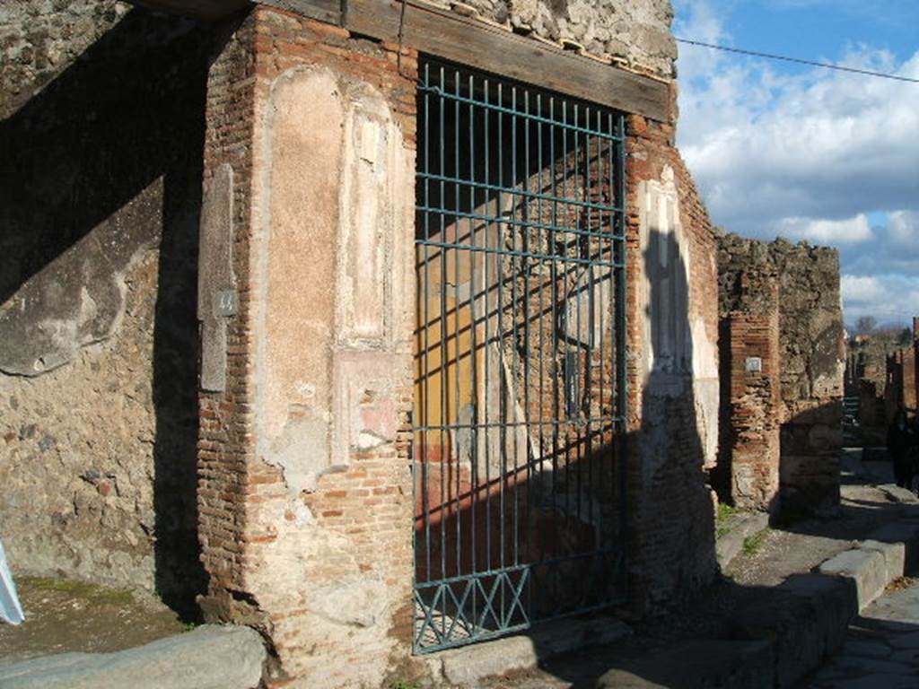 Via degli Augustali, north side, December 2004. Looking east from VII.2.45. 