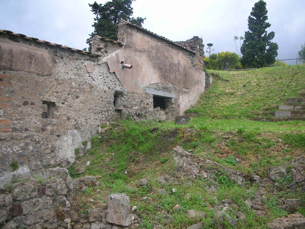 VI.1.26 Pompeii. May 2010. 
Looking towards north end of Vicolo di Narciso, and agger of south side of city wall. Photo courtesy of Ivo van der Graaff.
