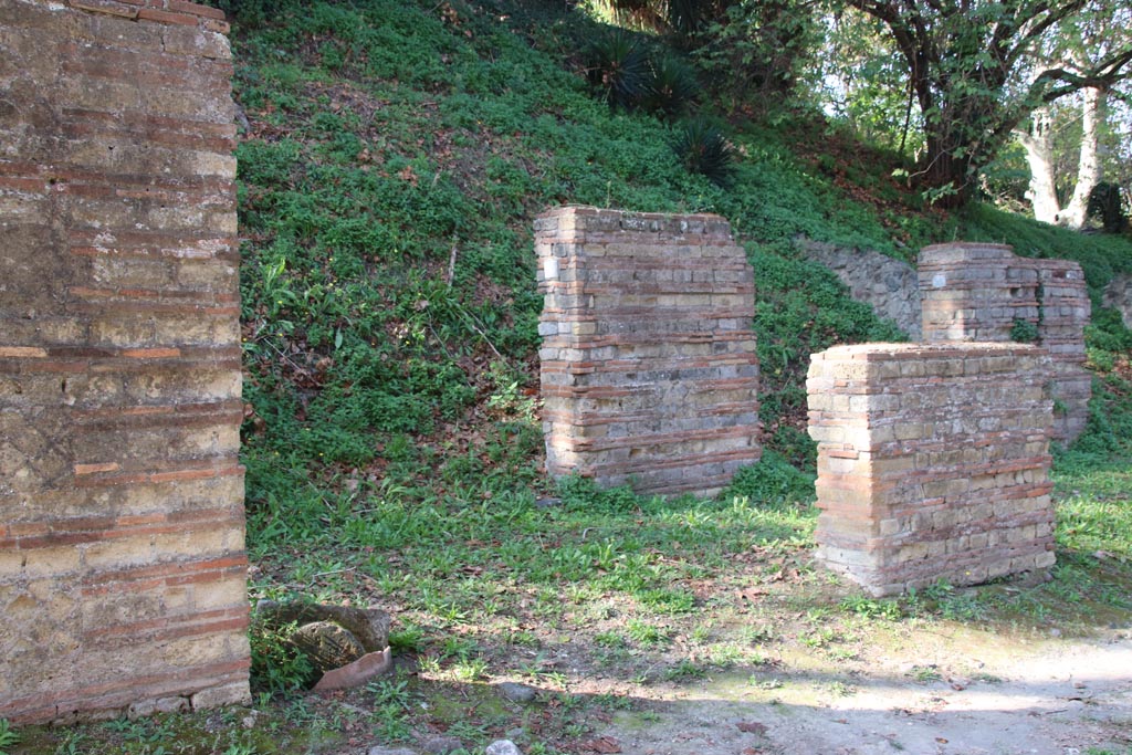 HGW11 Pompeii. October 2023. Looking north-west towards portico in front of shops. Photo courtesy of Klaus Heese.