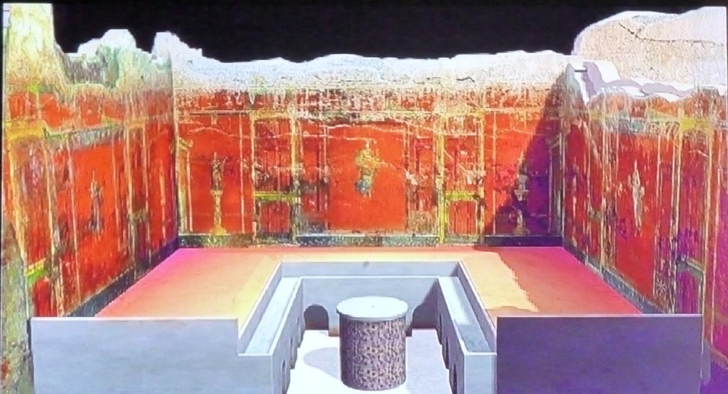 Complesso dei triclini in località Moregine a Pompei. September 2015. Triclinium A as shown on a display in the Palaestra.
A small channel ran around inside the triclinium and was fed by 14 water jets. 
The base of the round table was painted with plants, flowers and fruits, and the floor was covered with mosaic.

