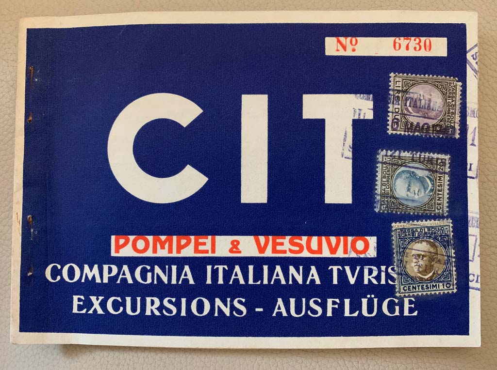 Cover of an old carnet for excursions to Vesuvius and Pompeii. It’s hard to read the date on the stamps. It looks like 6 May 1940
According to Rick –
“A May 1940 date is very feasible.
The Compagnia Italiana Turismo was set up in 1927 by the Fascists and ran until 2008.
The portrait on the stamps is Victor Emmanuel III who abdicated in 1946.
The Italian State was actively promoting tourism up to 1943.
The Funiculare was out of action from 1944 to 1947 and was replaced by the chairlift in 1953.”
Photo courtesy of Rick Bauer.
