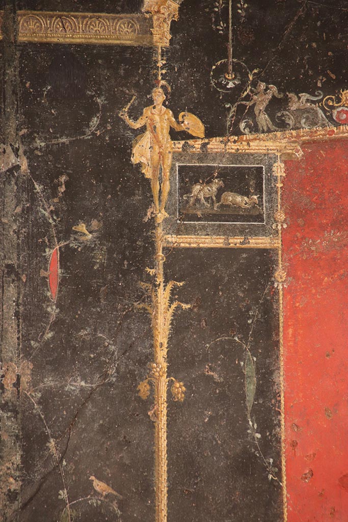 VI.15.1 Pompeii. October 2024. 
Detail from top of candelabra from right side of panel at west end of north wall. Photo courtesy of Klaus Heese.
