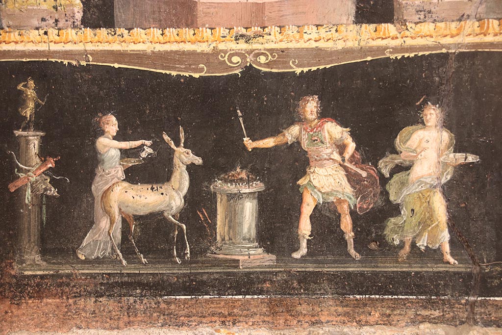 VI.15.1 Pompeii. October 2024. Detail from east wall with painting of a stag being sacrificed to Diana. Photo courtesy of Klaus Heese.