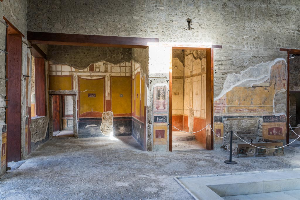 VI.15.1 Pompeii. March 2023. 
Looking north across west end of atrium from south ala, towards north ala, on left. Photo courtesy of Johannes Eber.

