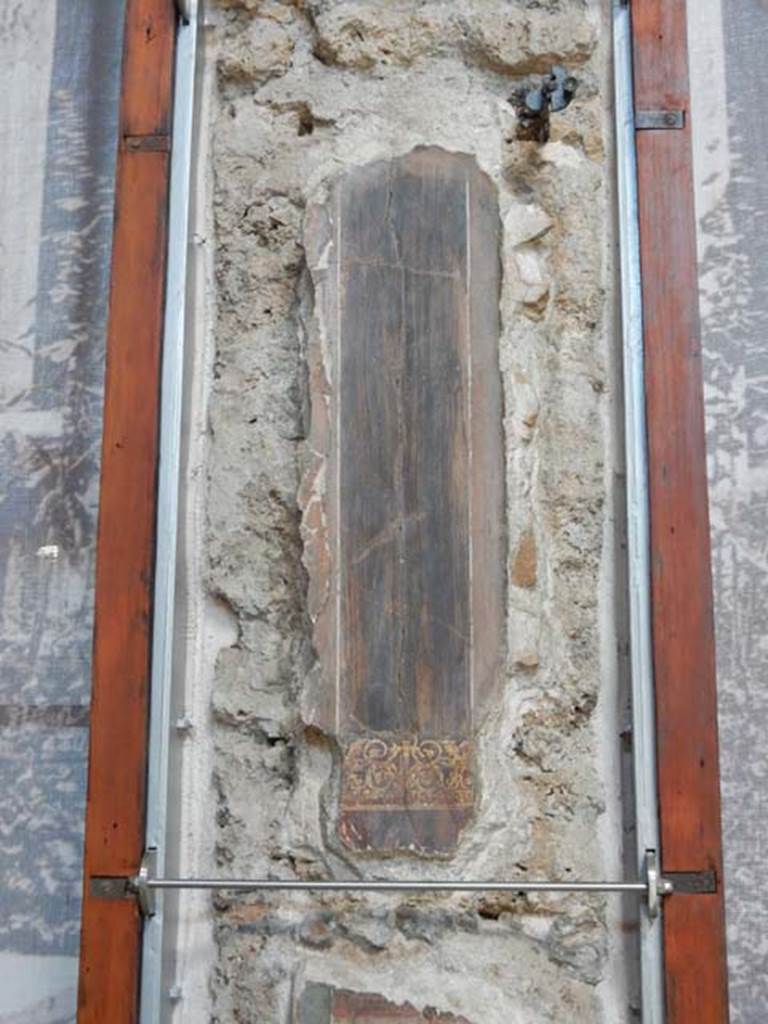 VI.15.1 Pompeii. May 2017. Detail of painted panel on west wall of atrium, leading onto peristyle. Photo courtesy of Buzz Ferebee.
