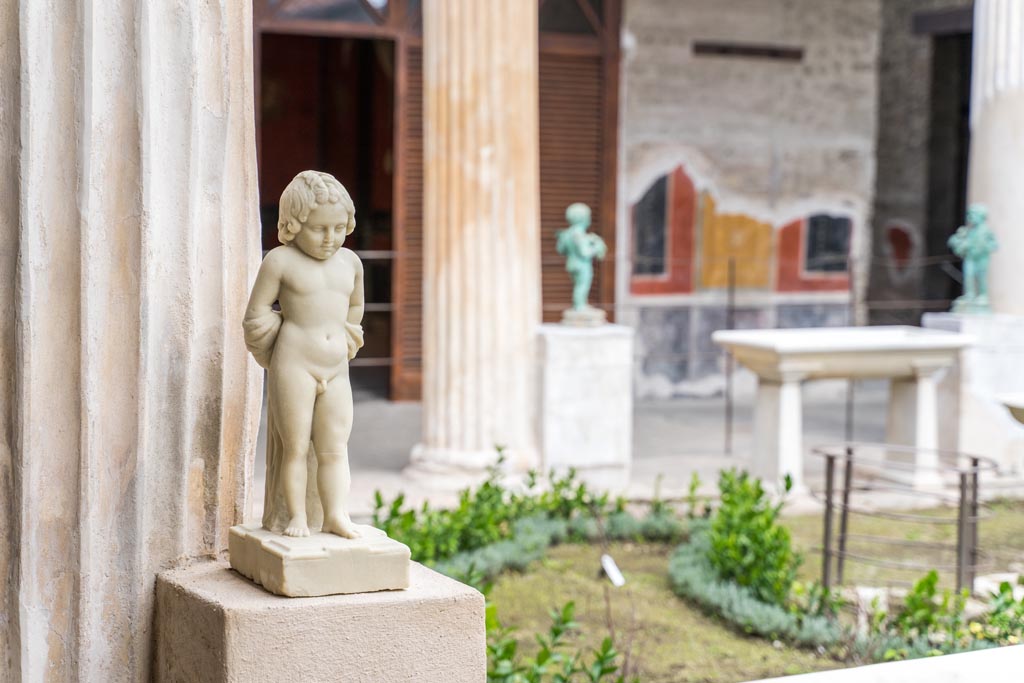 VI.15.1 Pompeii. March 2023. Statue on west side of peristyle, looking north-east. Photo courtesy of Johannes Eber.

