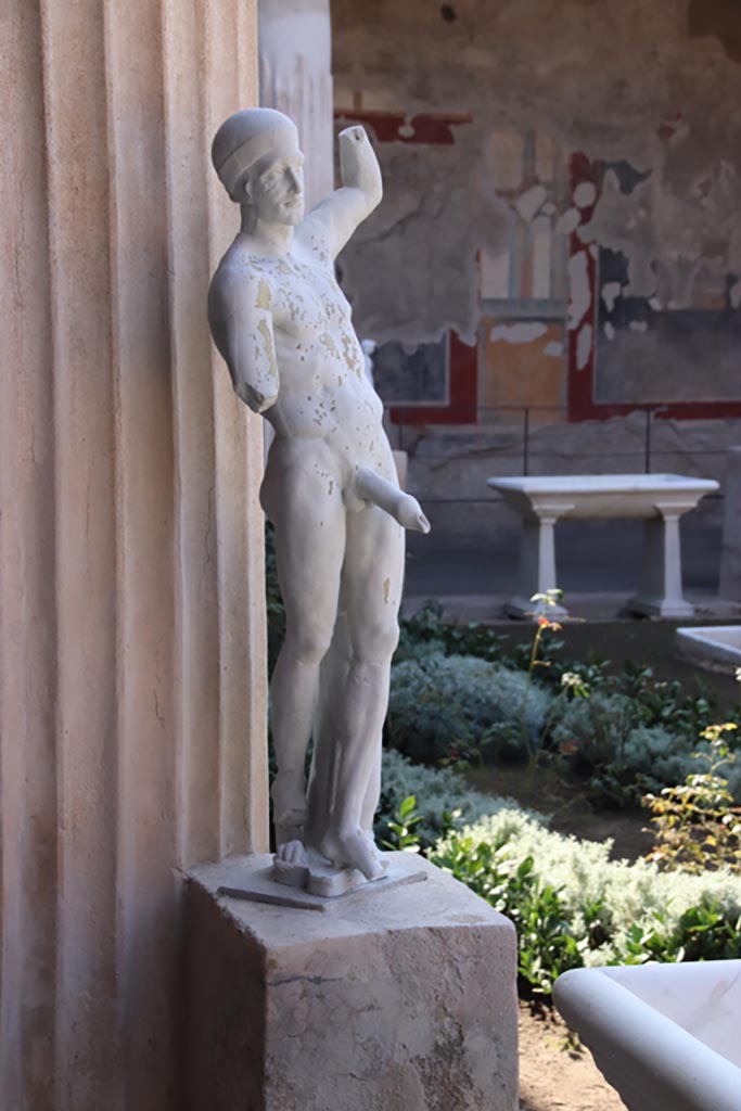 VI.15.1 Pompeii. October 2023. 
Reproduction of marble Priapos on display in peristyle, but found near kitchen area.
Photo courtesy of Klaus Heese.
