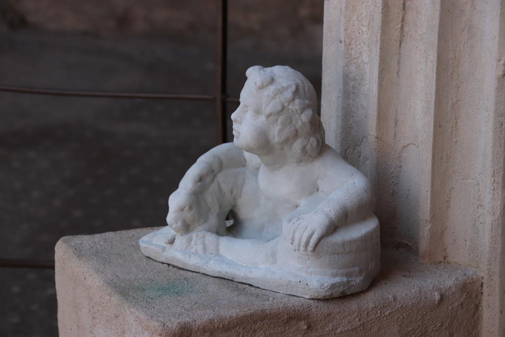 VI.15.1 Pompeii. October 2023. Detail of statuette in south-west corner. Photo courtesy of Klaus Heese.