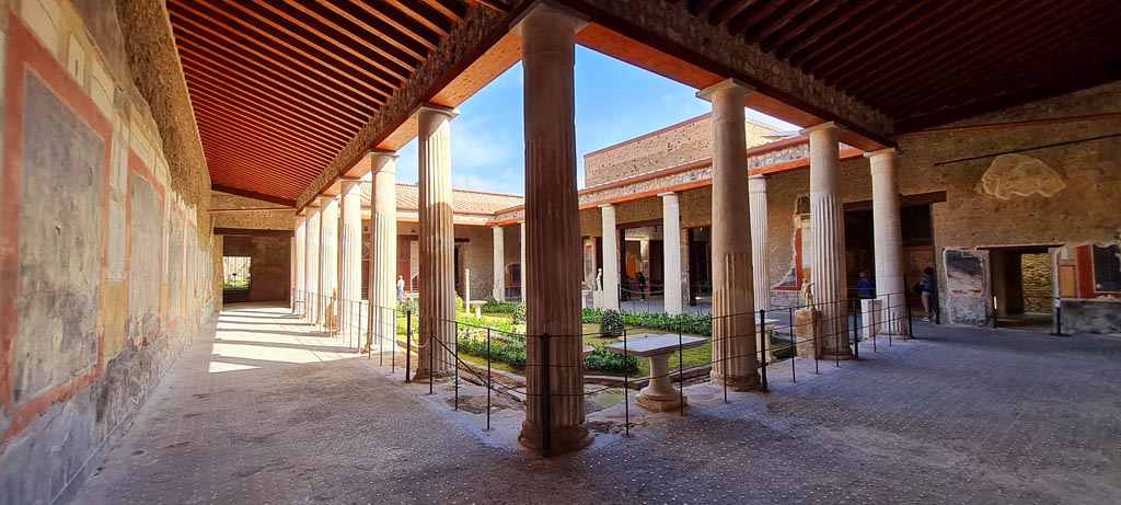 VI.15.1 Pompeii. April 2023. Looking north-east across portico from south-west corner. Photo courtesy of Giuseppe Ciaramella.