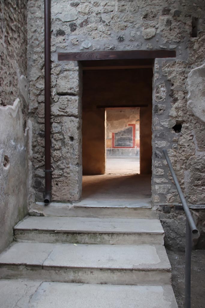 VI.15.27 Pompeii. October 2023. 
South-west corner with steps to room o, leading to peristyle. Photo courtesy of Klaus Heese.
