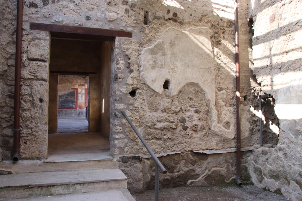 VI.15.27 Pompeii. October 2023. 
Looking towards west wall, with doorway to room o, in south-east corner of peristyle. Photo courtesy of Klaus Heese.
