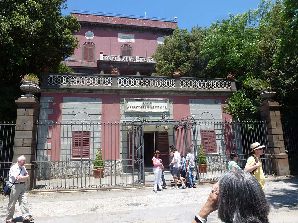 Vesuvius, June 2012. Observatory with plaque above the door: Reale Osservatorio Vesuviano (Royal Vesuvius Observatory). 
Photo courtesy of Michael Binns.
The upper plaque at roof level commemorates its founding in 1841, by Ferdinando II of Bourbon, King of The Two Sicilies.
It is the oldest volcanology observatory in the world. 
The Vesuvius Observatory is responsible for monitoring of active volcanoes such as Vesuvius, Campi Flegrei and Ischia.
Now it is home to the Naples branch of the Istituto Nazionale di Geofisica e Vulcanologia (INGV), the National Institute of Geophysics and Volcanology. 
